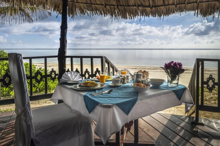 A private breakfast set-up overlooking the ocean at Breezes Beach Club and Spa, Zanzibar.