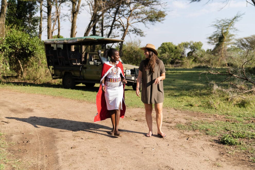 A woman on a guided nature walk with a Masai guide at Basecamp Adventure, Kenya.