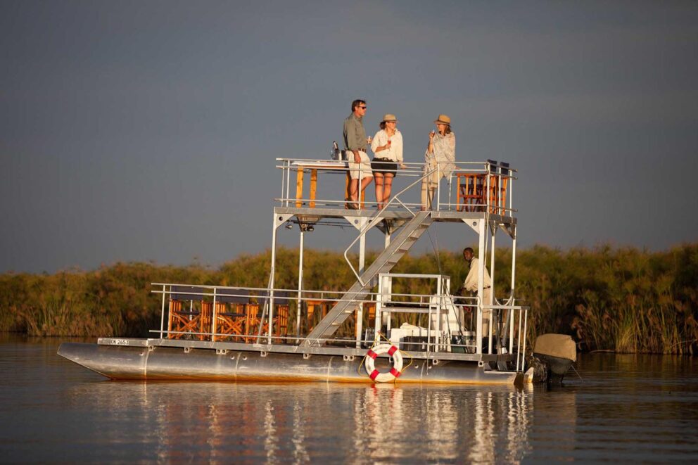 Barge with a group of people on it | Photo credit: Mopiri
