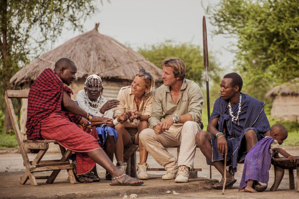 Guests visiting a village on a cultural tour near Forest Chem Chem in Tarangire National Park, Tanzania.