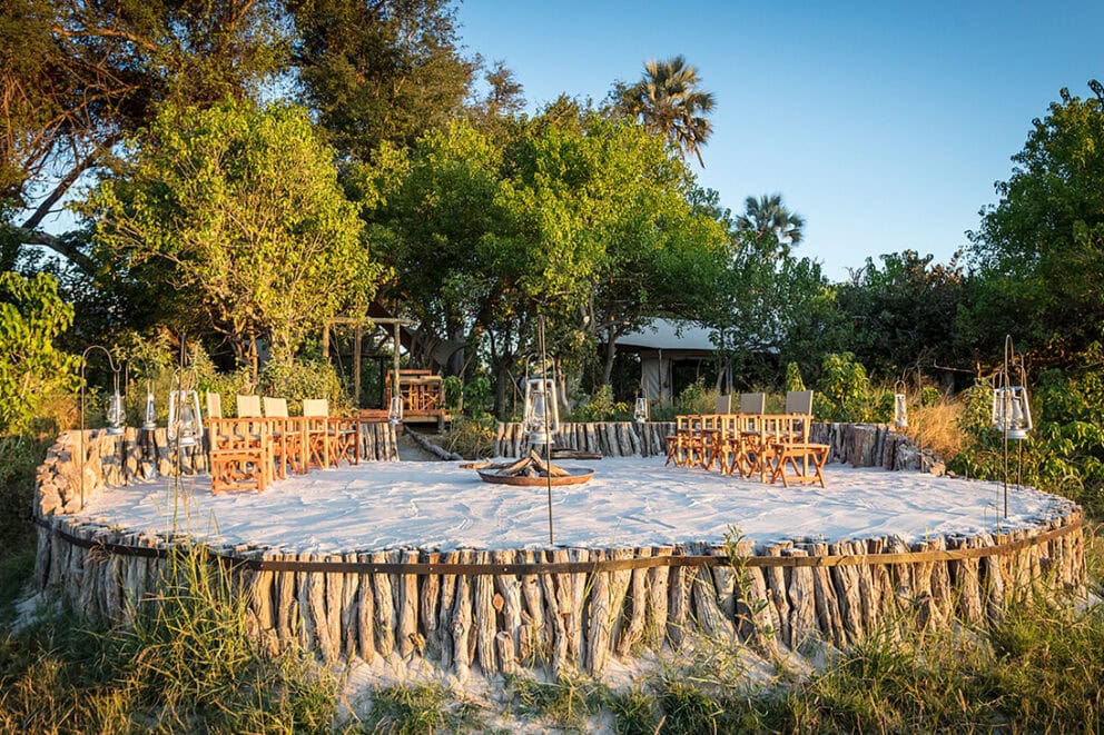 View of the boma with comfortable seating at Amber River Camp, Botswana.
