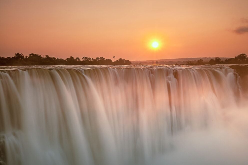 Victoria Falls at Sunset in Zimbabwe | Photo credit: 2630ben via Canva