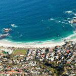 View down to beach of Camps Bay from top of Table Mountain, Cape Town, South Africa. Photo: Getty Images