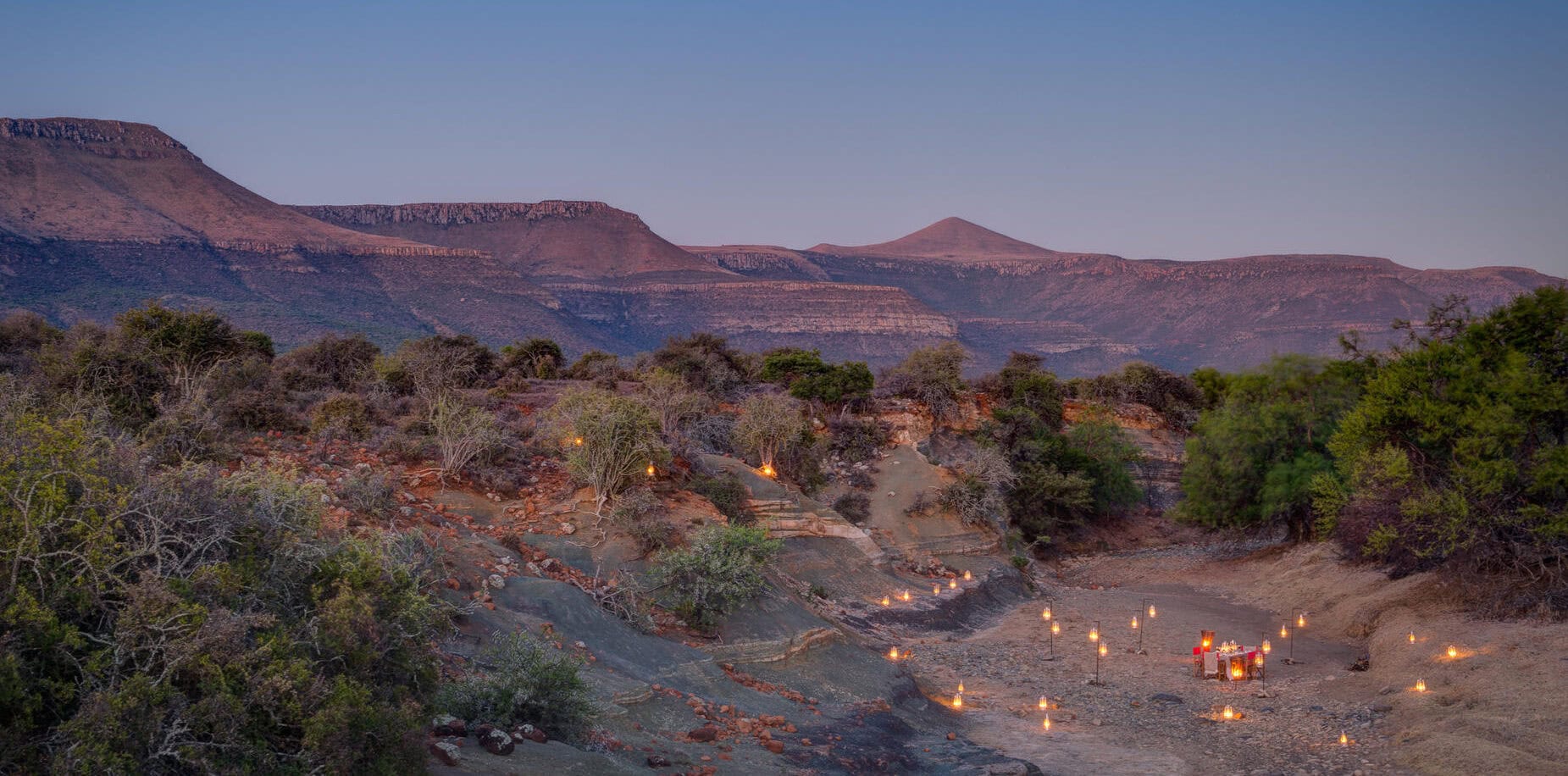 Picnic dinner in a dry riverbed in the Great Karoo in South Africa. This can be experienced as an addition to a birding safari