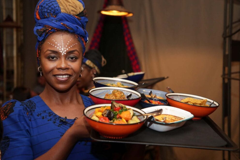 Gold Restaurant waitron serving guests | Photo: Gold Restaurant