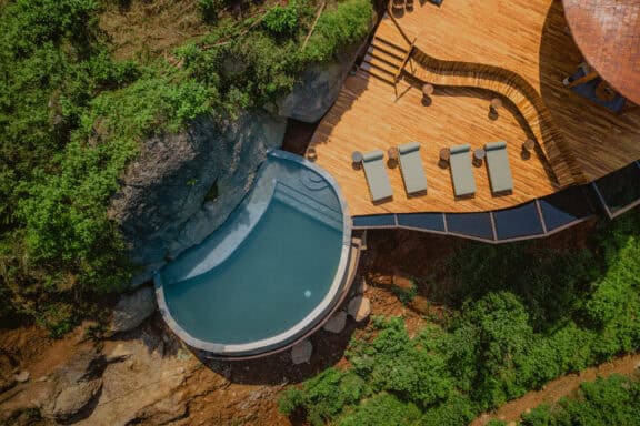 Aerial view of the pool deck and sun loungers at Erebero Hills, Uganda