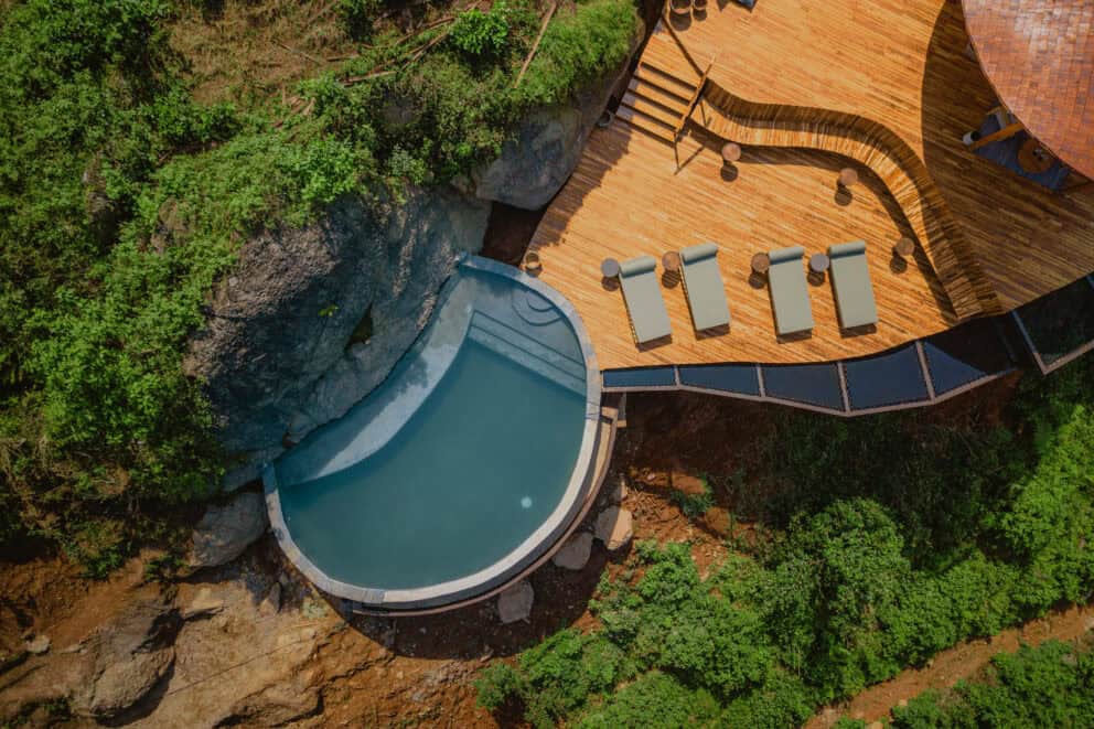 Aerial view of the pool deck and sun loungers at Erebero Hills, Uganda
