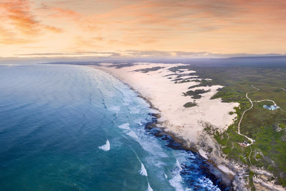 Aerial view of Morukuru Beach Lodge and the protected marine area.