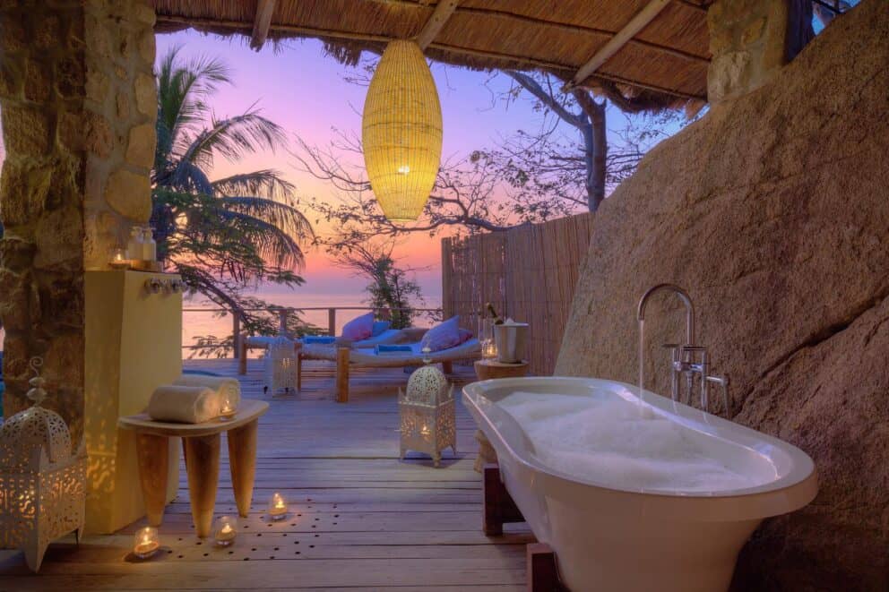 A luxury open-air bathroom area at Kaya Mawa, Malawi