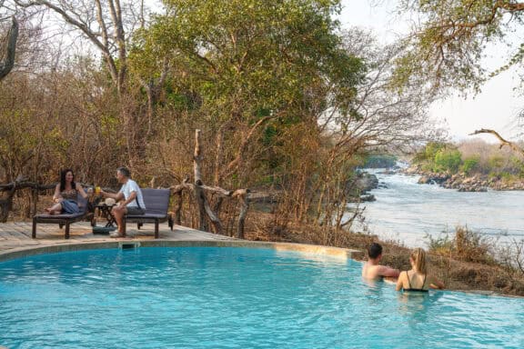 Guests in the pool at Mkulumadzi Lodge Malawi
