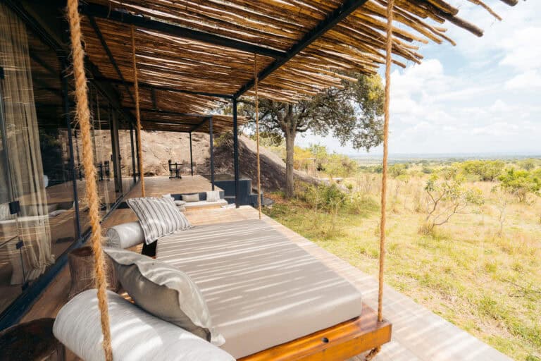 An outdoor swing bed suspended over the deck at Nimali Mara.