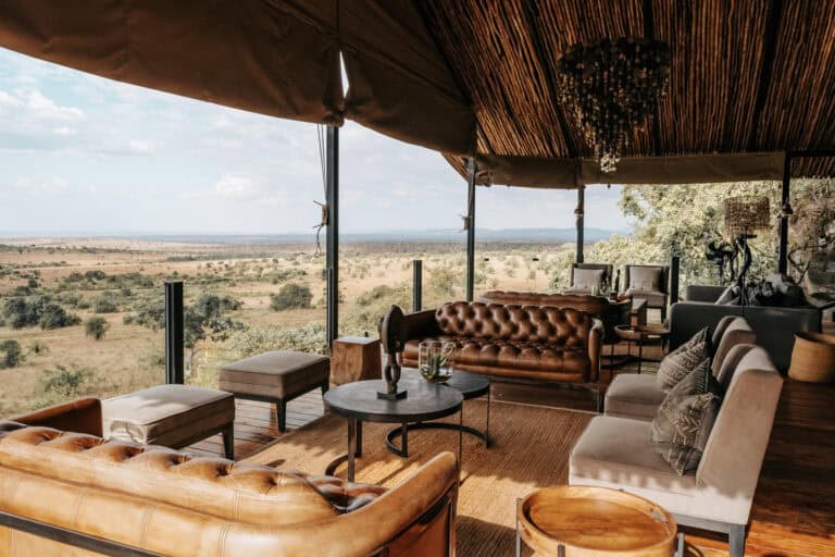 Outdoor lounge area with comfy leather seating at Nimali Mara.