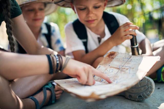 Children learning to read a map.