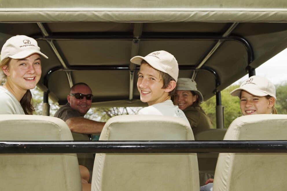 A family in a safari vehicle at Kanana, Botswana.
