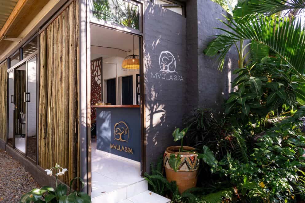 Mvula Spa entrance surrounded by green foliage at Shongwe Oasis, Zimbabwe.