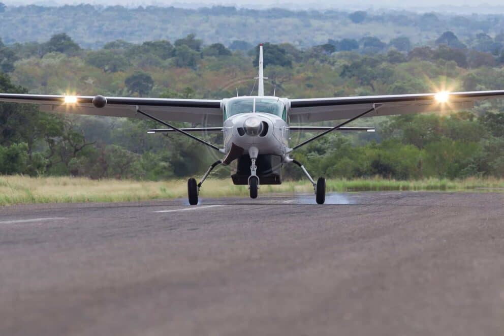 A FedAir bush plane taking off from a runway in South Africa.