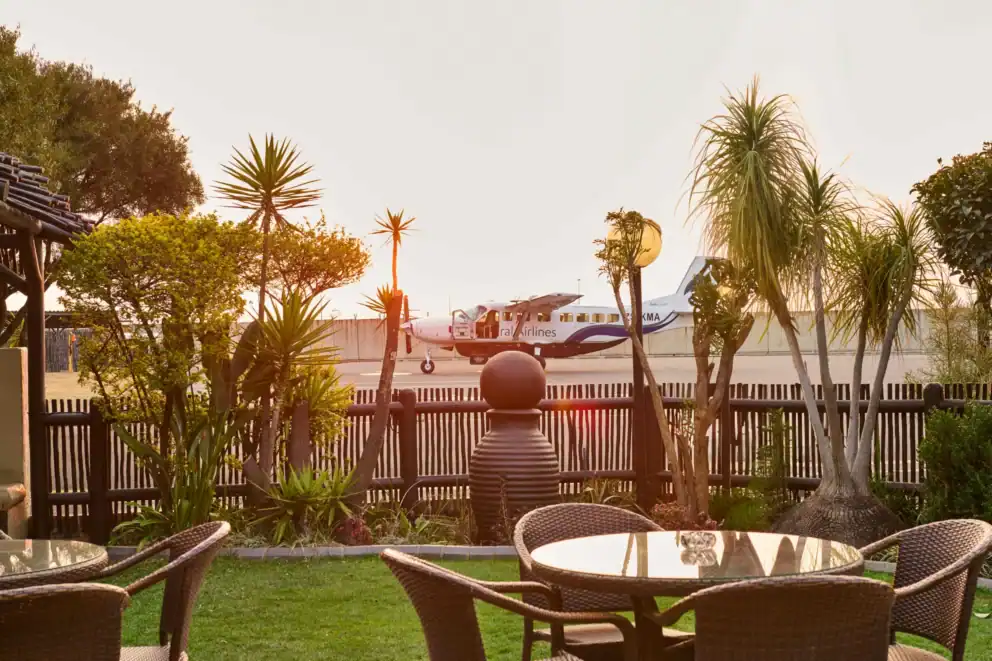 View of a FedAir plane on the tarmac at sunset in South Africa.