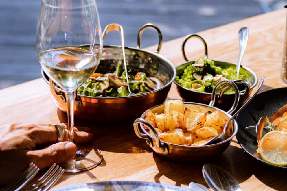 A table setting with gourmet foods in individual serving dishes at Royal Malewane, South Africa.