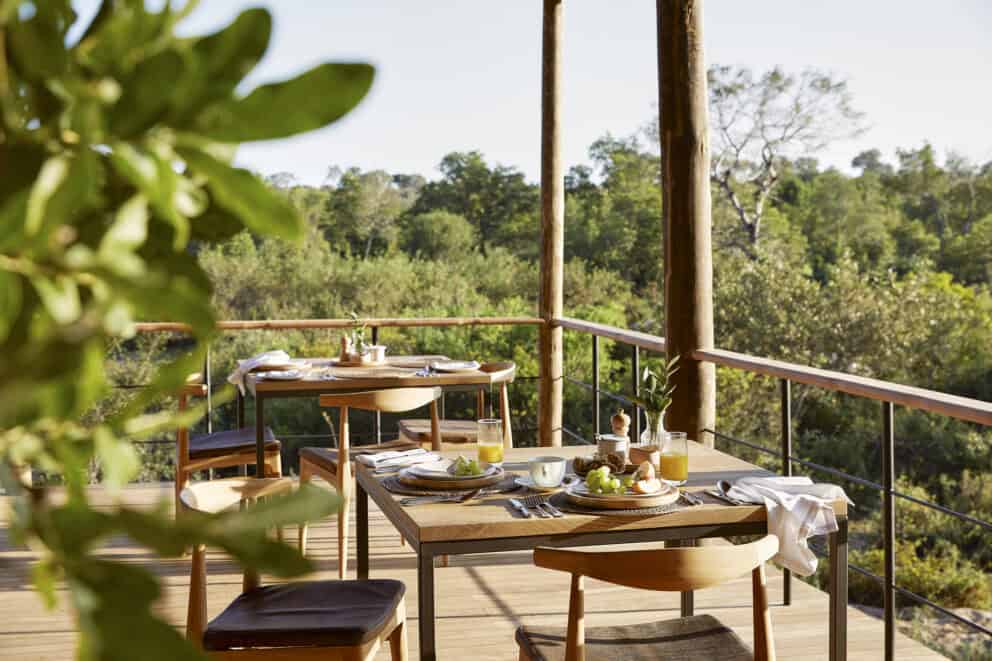 Outdoor dining on the main deck with breathtaking views over the African bush at Londolozi Founders Camp, South Africa.