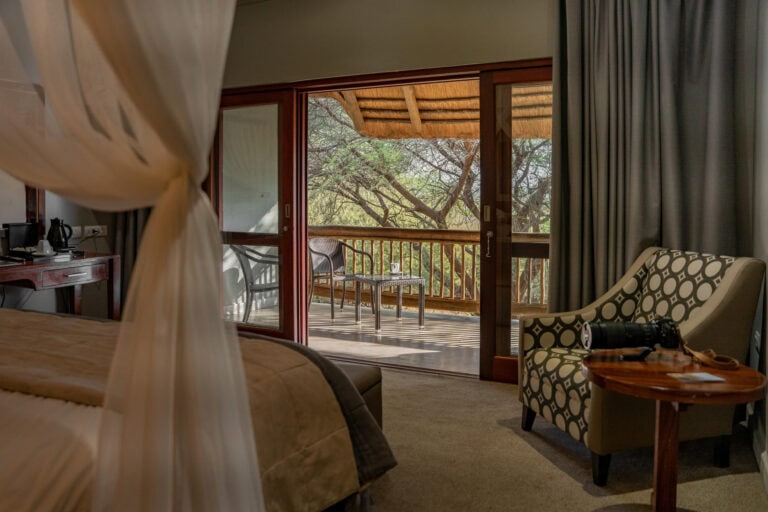 View of the private balcony from the bed at Chobe Safari Lodge, Botswana.