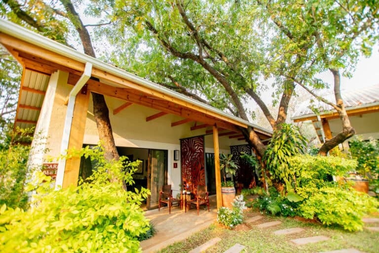 View of the lush grounds from the bedroom suite at Shongwe Lookout, Zimbabwe.
