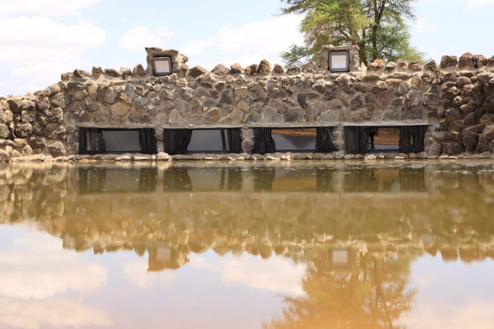Exterior view of the photo hide across the water at Soroi Larsens Camp, Kenya.