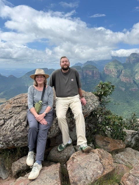 Tourists photographed with the Three Rondavels in the background along the Panorama Route, South Africa.