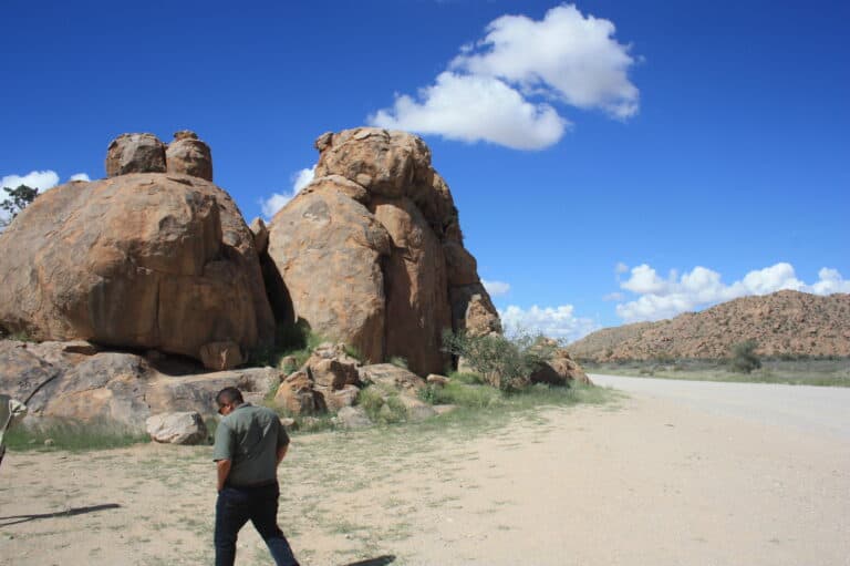 View of the arid desert landscape with rocky boulders in Namibia.