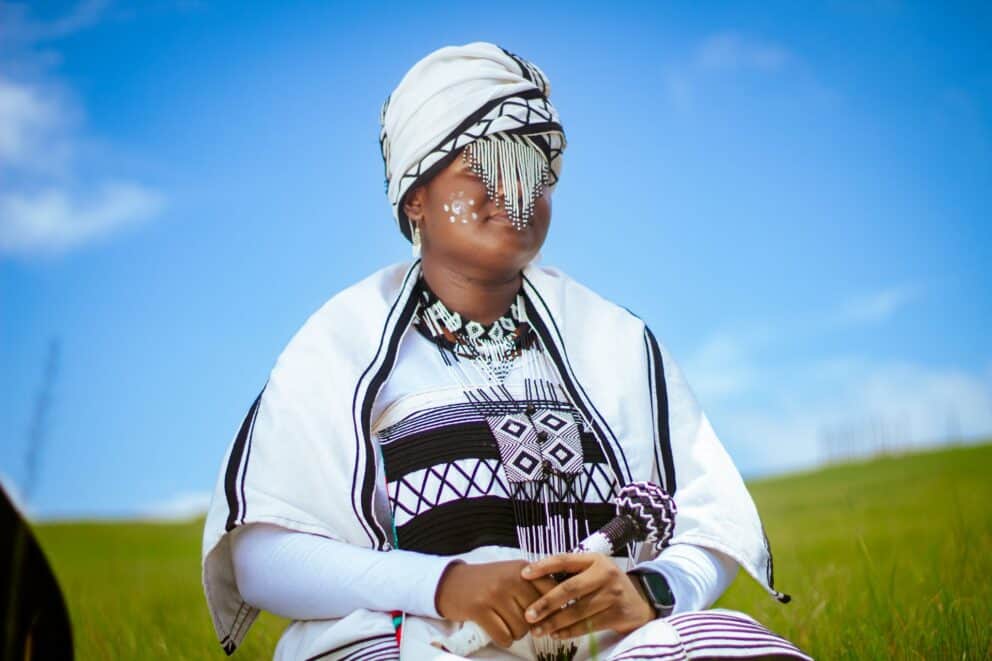 A woman wearing Xhosa traditional clothing with beautiful beadwork in South Africa.